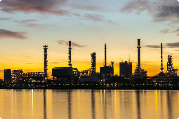 Process Oil and Gas Engineering Experts, Oil and gas refinery industry plant with glitter lighting and sunrise in the morning, Factory of petroleum industrial, Power plant, Energy power station area.